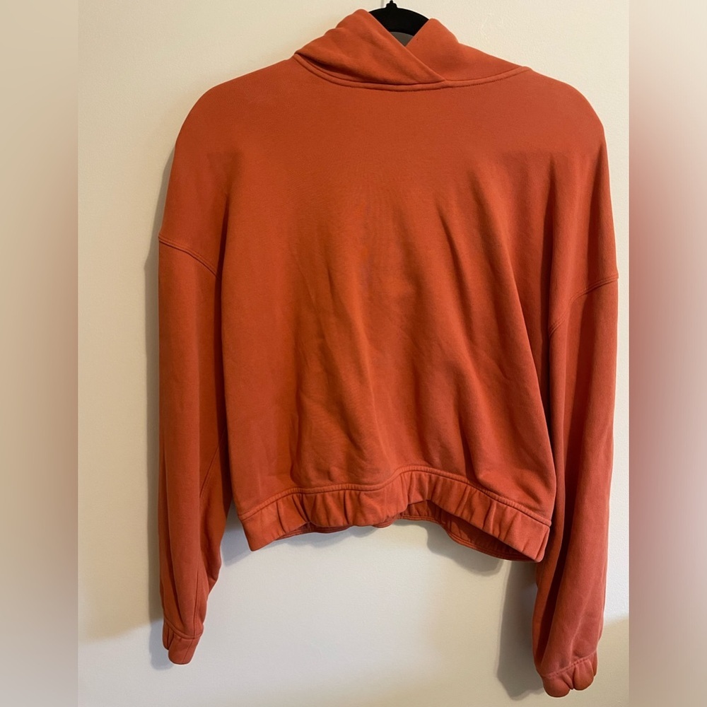 LULULEMON- Relaxed Cropped Hoodie in the color Canyon Orange.